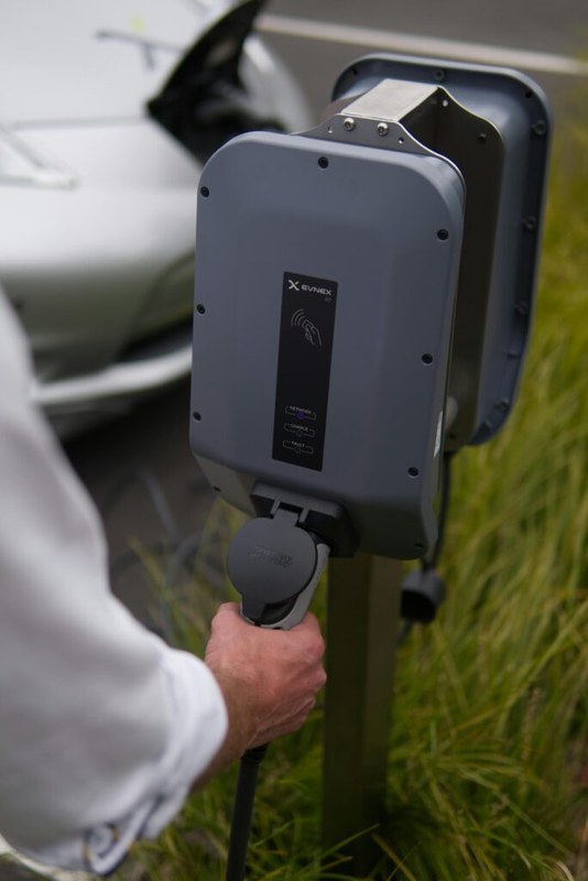 EV charging image related to Weather Suitability, Smart Features, and Warranty for Outdoor EVSE
